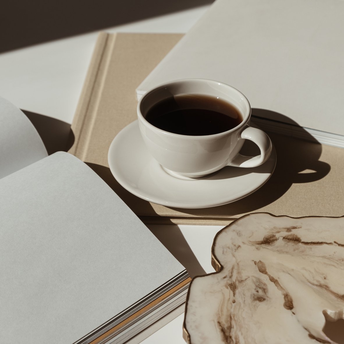 Coffee with Notebooks on Table